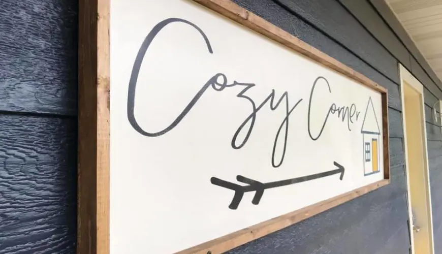 A sign that says cozy corner with an arrow.