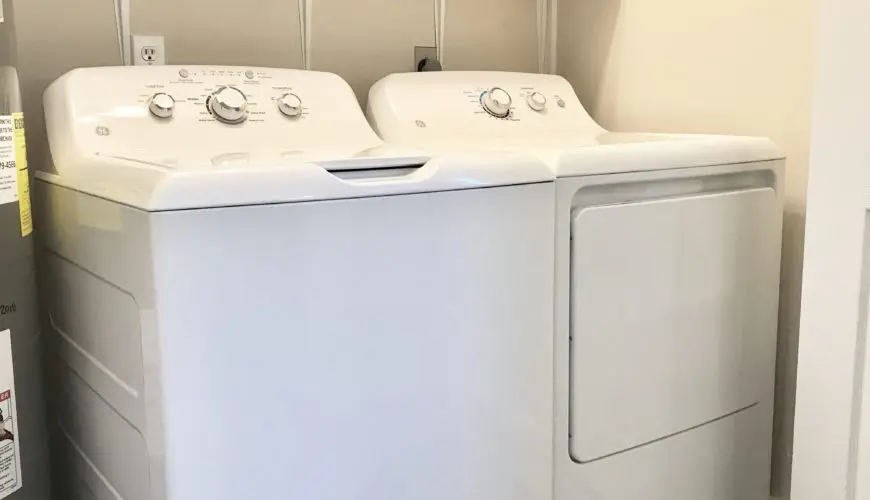 A white washer and dryer in a room.