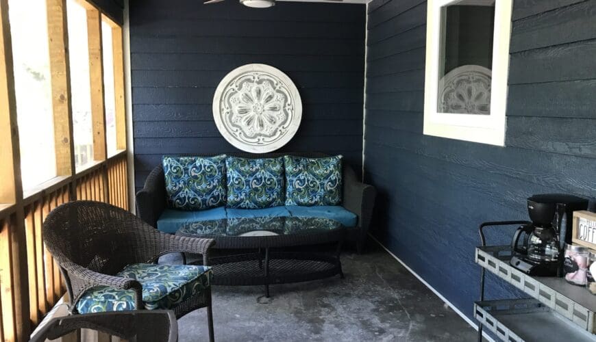 A room with blue walls and furniture.